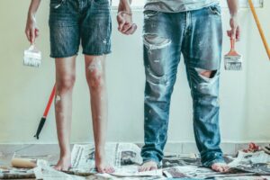 couple holding hands with paint stains - conflict in Christian marriagelict