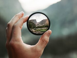 conflict tools for Christians - curiosity in conflict - magnifying glass with mountains